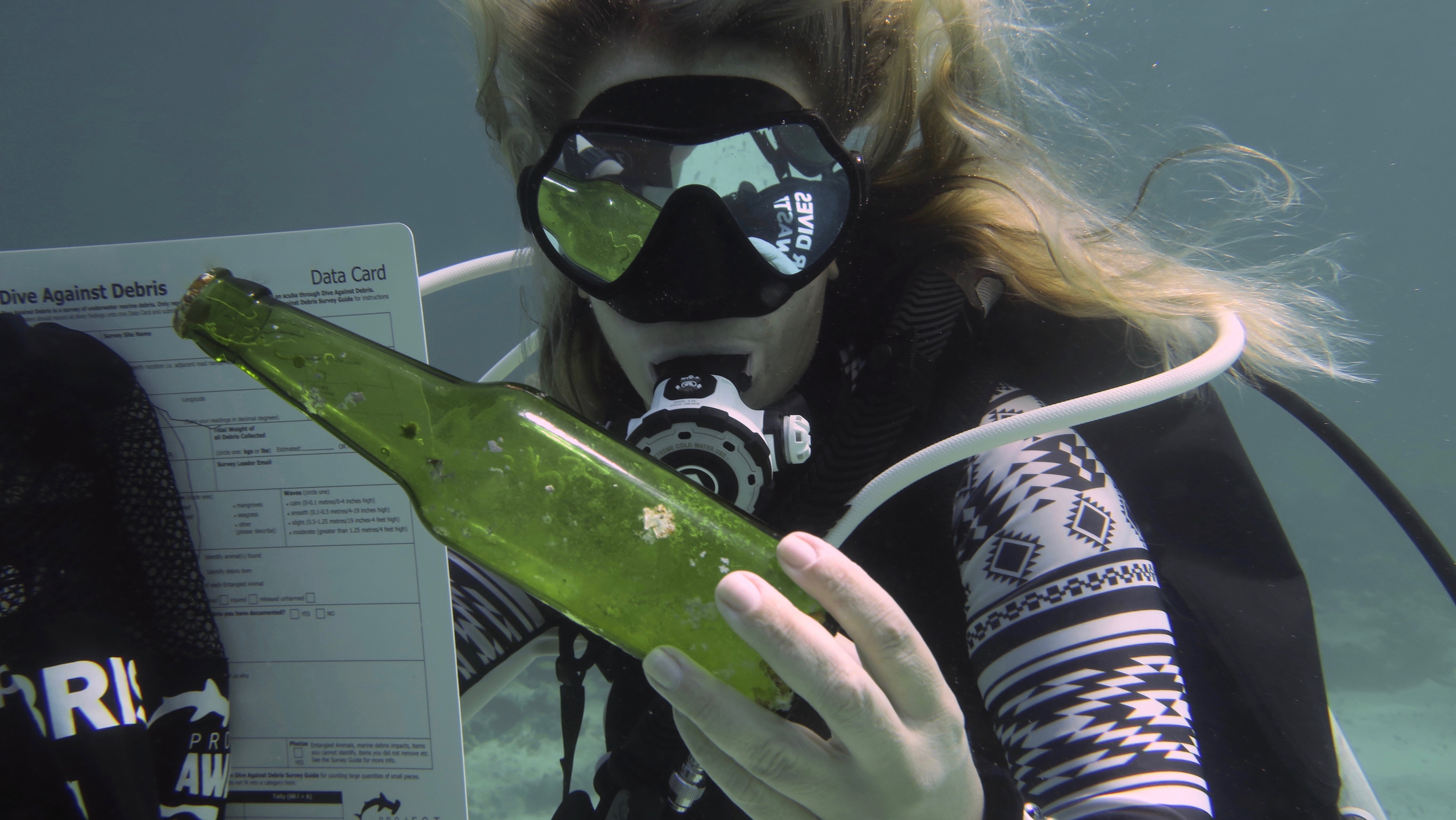 image of glass bottle underwater