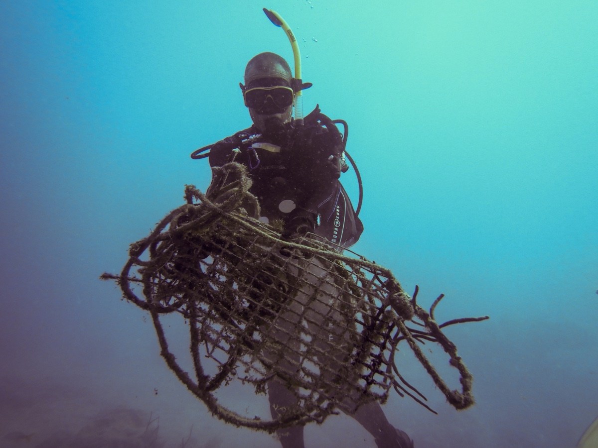 Doug Hoffman collects rope and trap pieces off the seafloor