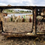 The frame of an old TV recovered from the ocean showcases the trash behind it